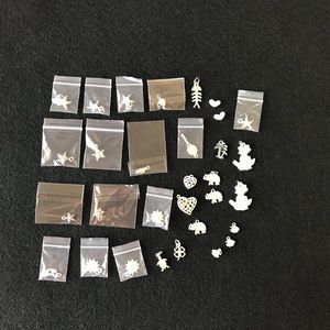 Huge lot of silver plated charms. B-104